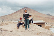 Boy with a lizard and the mountain of Potosi